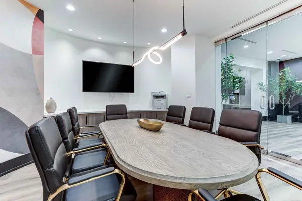 a kitchen with a table and chairs in it