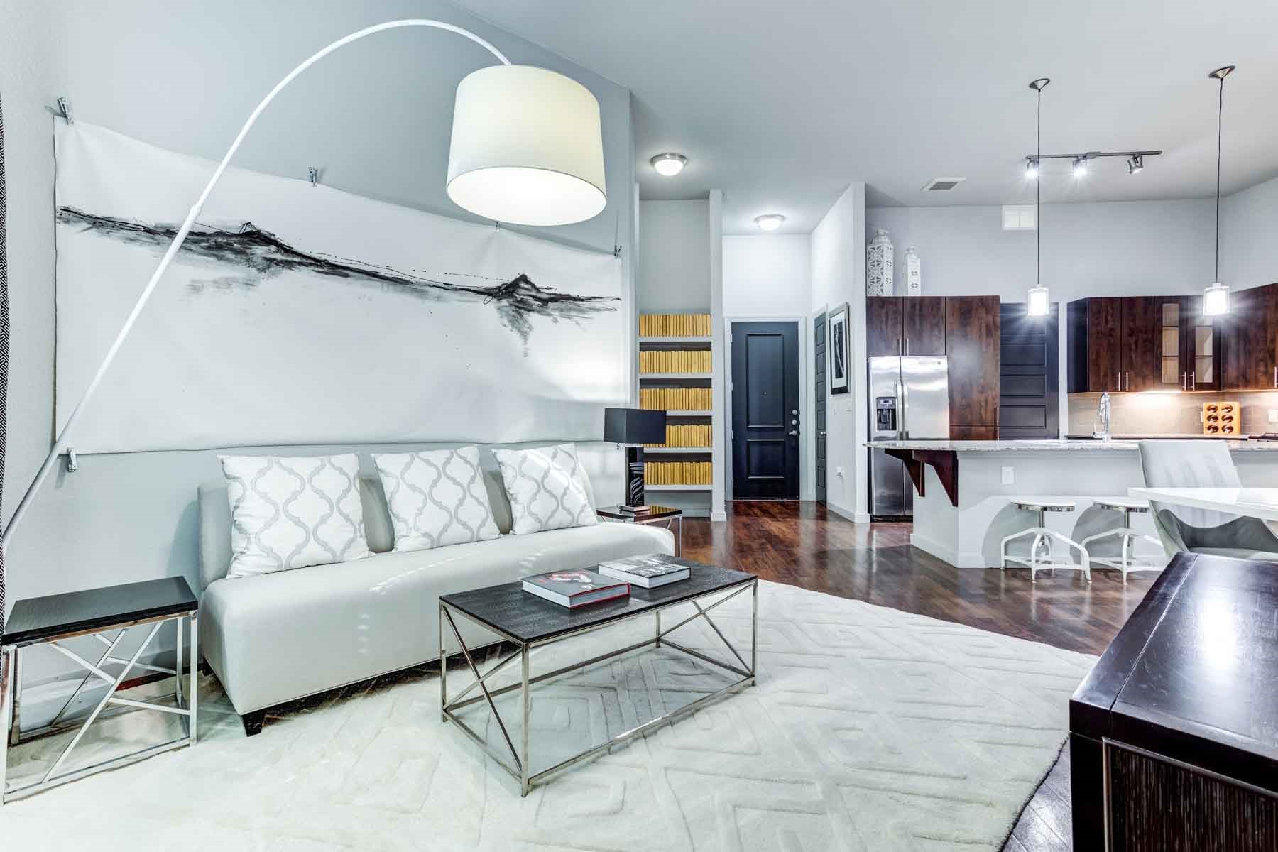 2525 McCue Road, Unit 519 Houston, TX 77056 - Photo 6 of 15 a living room with stainless steel appliances kitchen island granite countertop furniture and a wooden floor