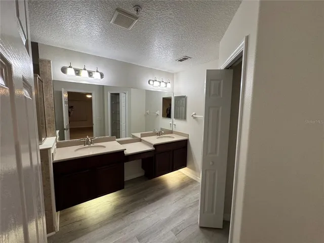 a bathroom view of a toilet and a shower