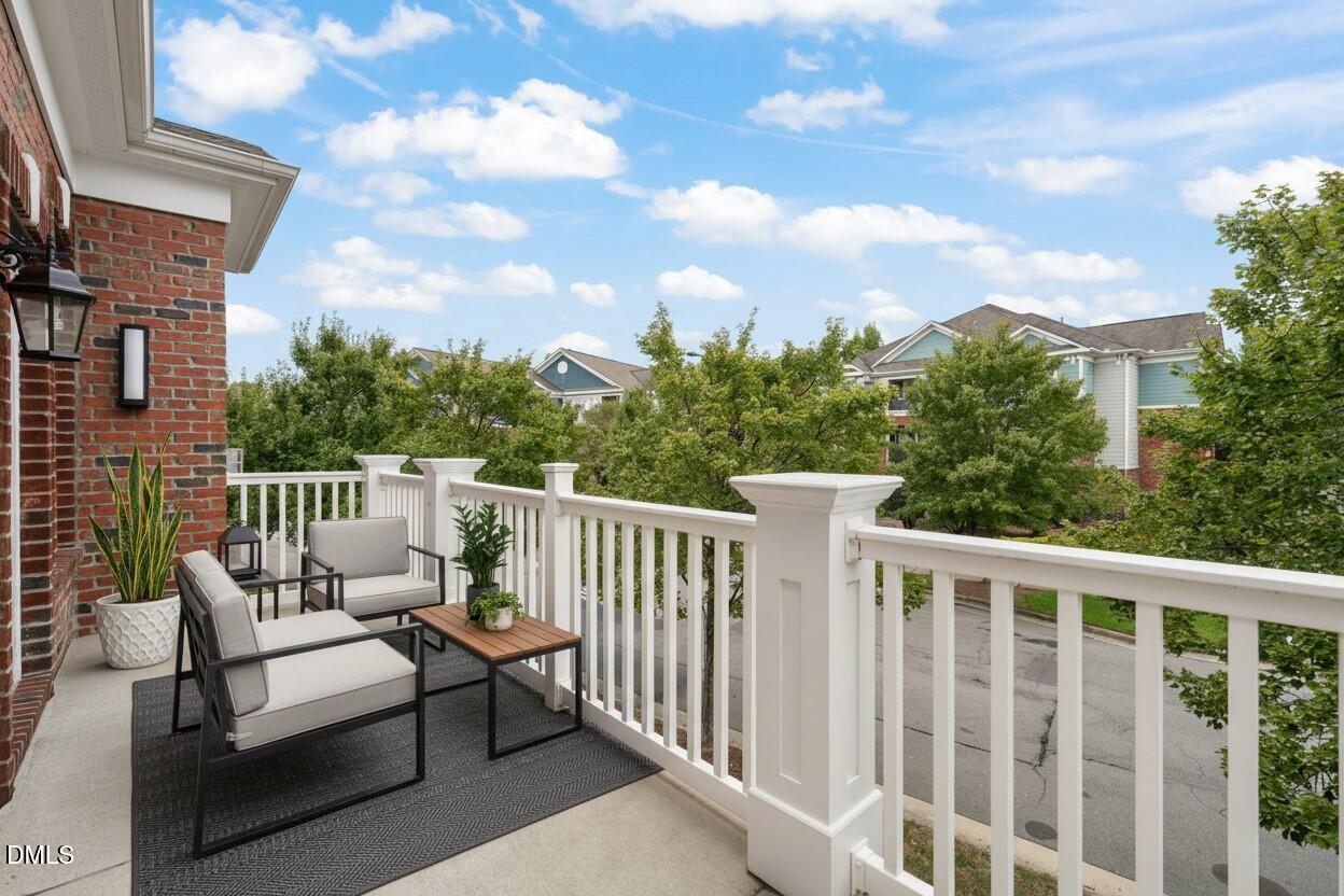 10510 Sablewood Drive, Unit 206 Raleigh, NC 27617 - Photo 7 of 48 Living room Balcony Staged
