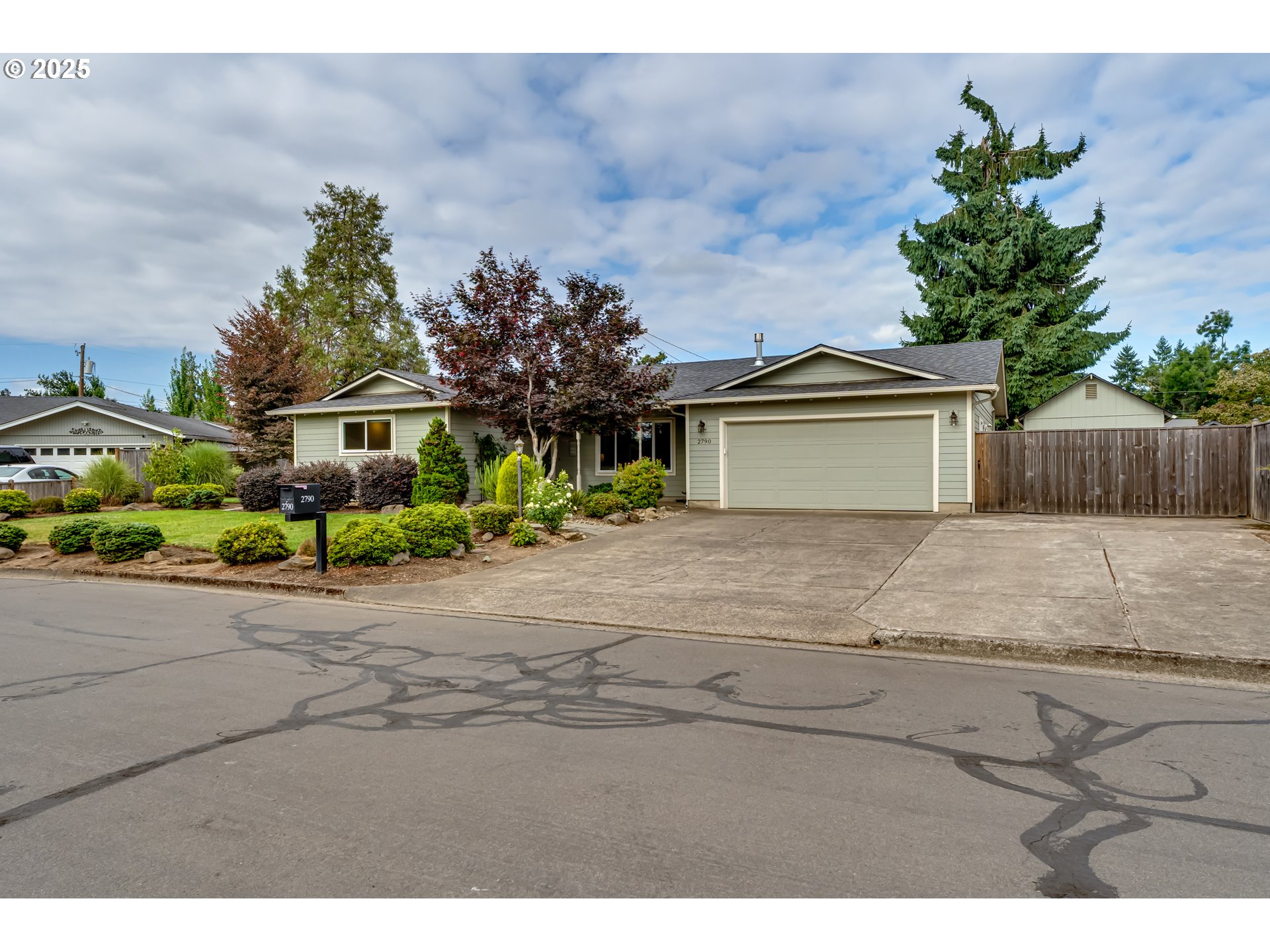 2790 32nd Street Springfield, OR 97477 - Photo 1 of 36 a front view of a house with a yard and garage