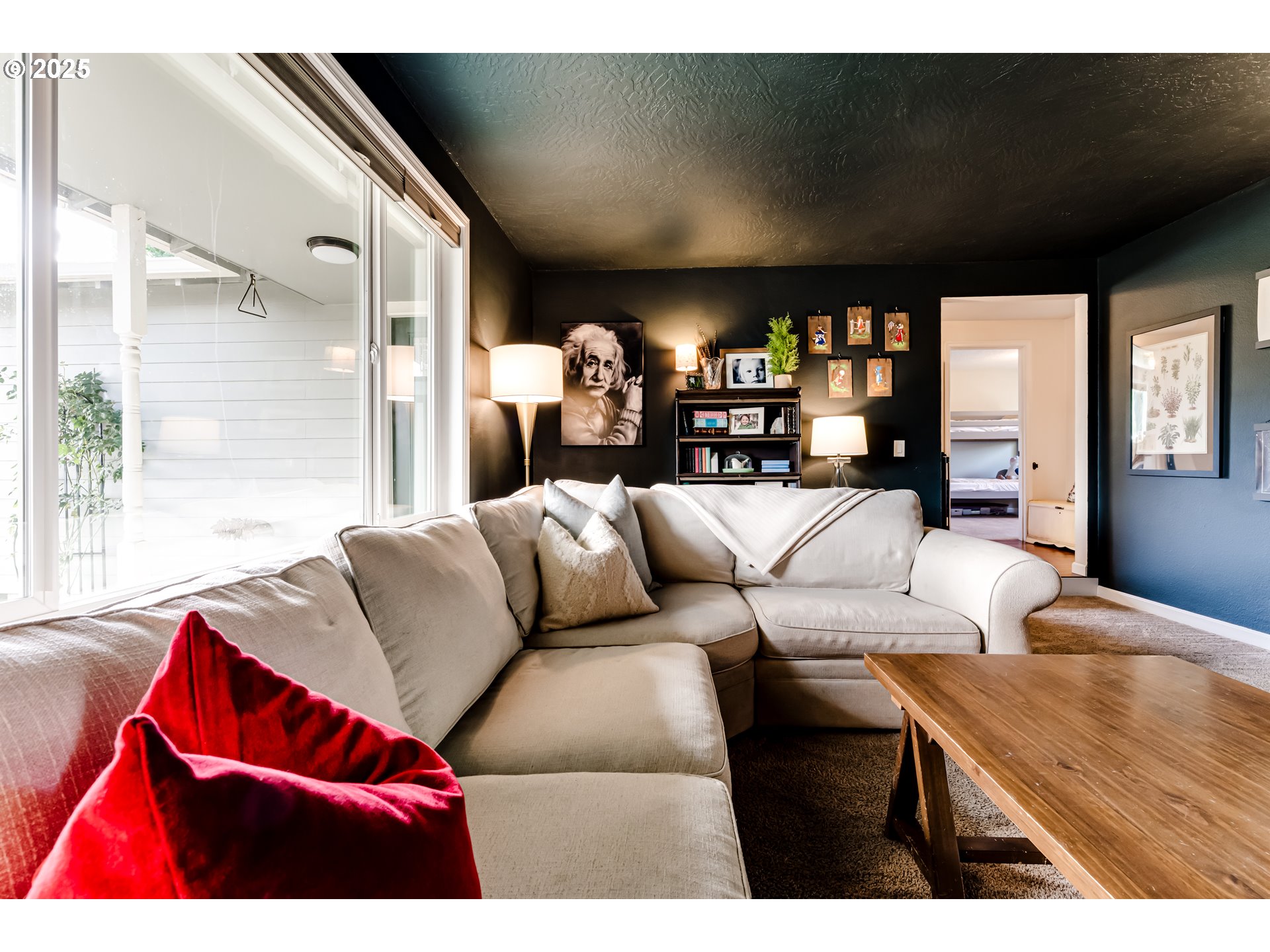 2790 32nd Street Springfield, OR 97477 - Photo 12 of 36 a living room with furniture a large window and chandelier