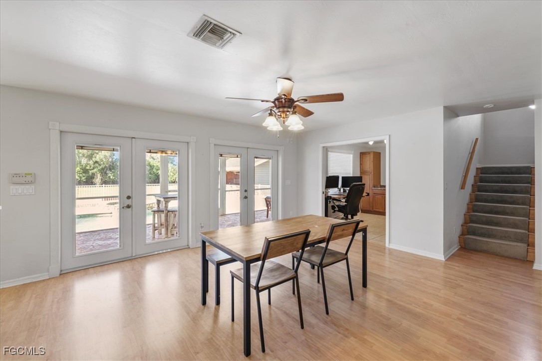 2870 Hickey Creek Road Alva, FL 33920 - Photo 18 of 45 a view of a dining room with furniture and wooden floor
