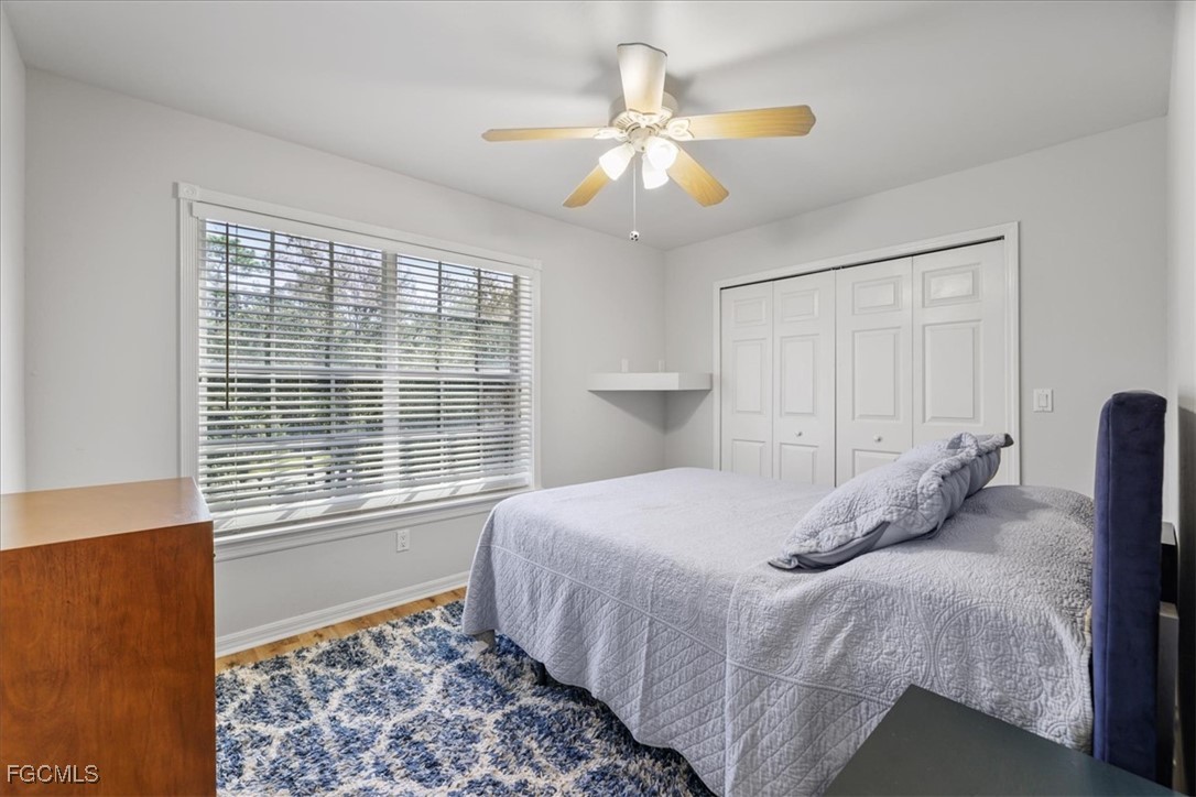 2870 Hickey Creek Road Alva, FL 33920 - Photo 25 of 45 a bedroom with a bed and a window