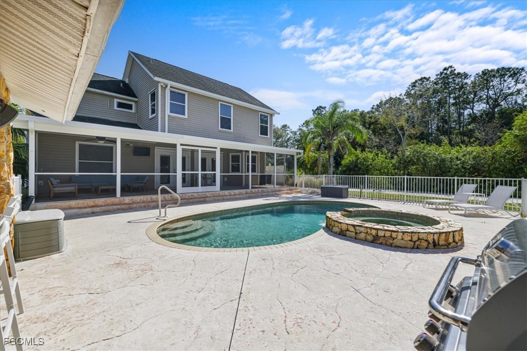 2870 Hickey Creek Road Alva, FL 33920 - Photo 36 of 45 a view of a house with backyard and sitting area