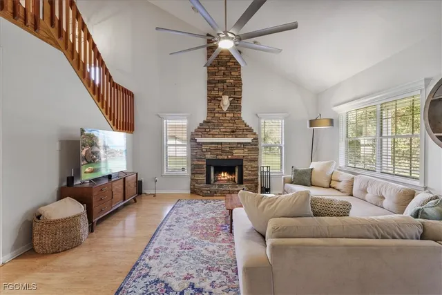 a view of a a dining room with furniture window and wooden floor