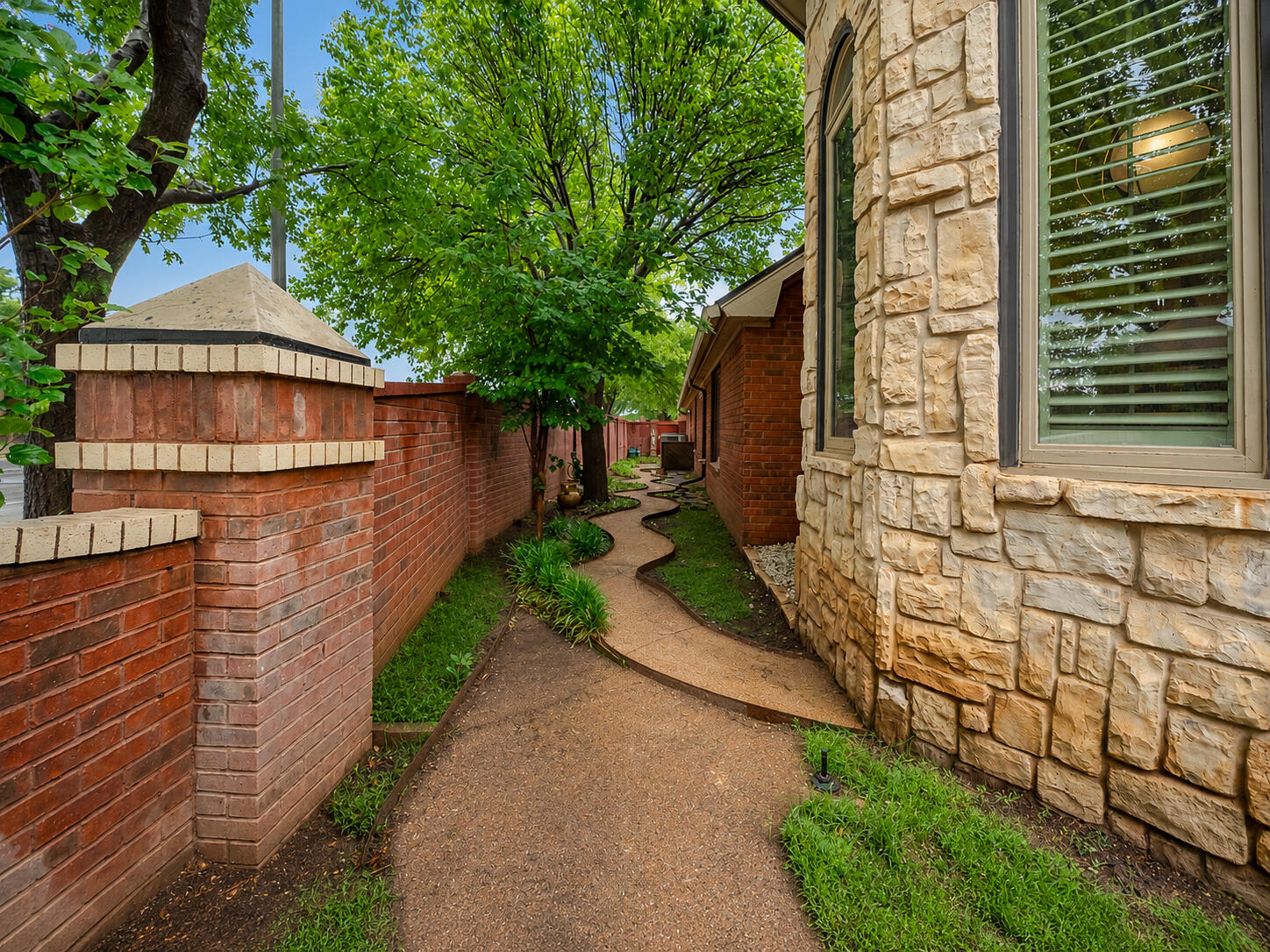 4226 97th Place Lubbock, TX 79423 - Photo 6 of 52 a front view of a house with a yard