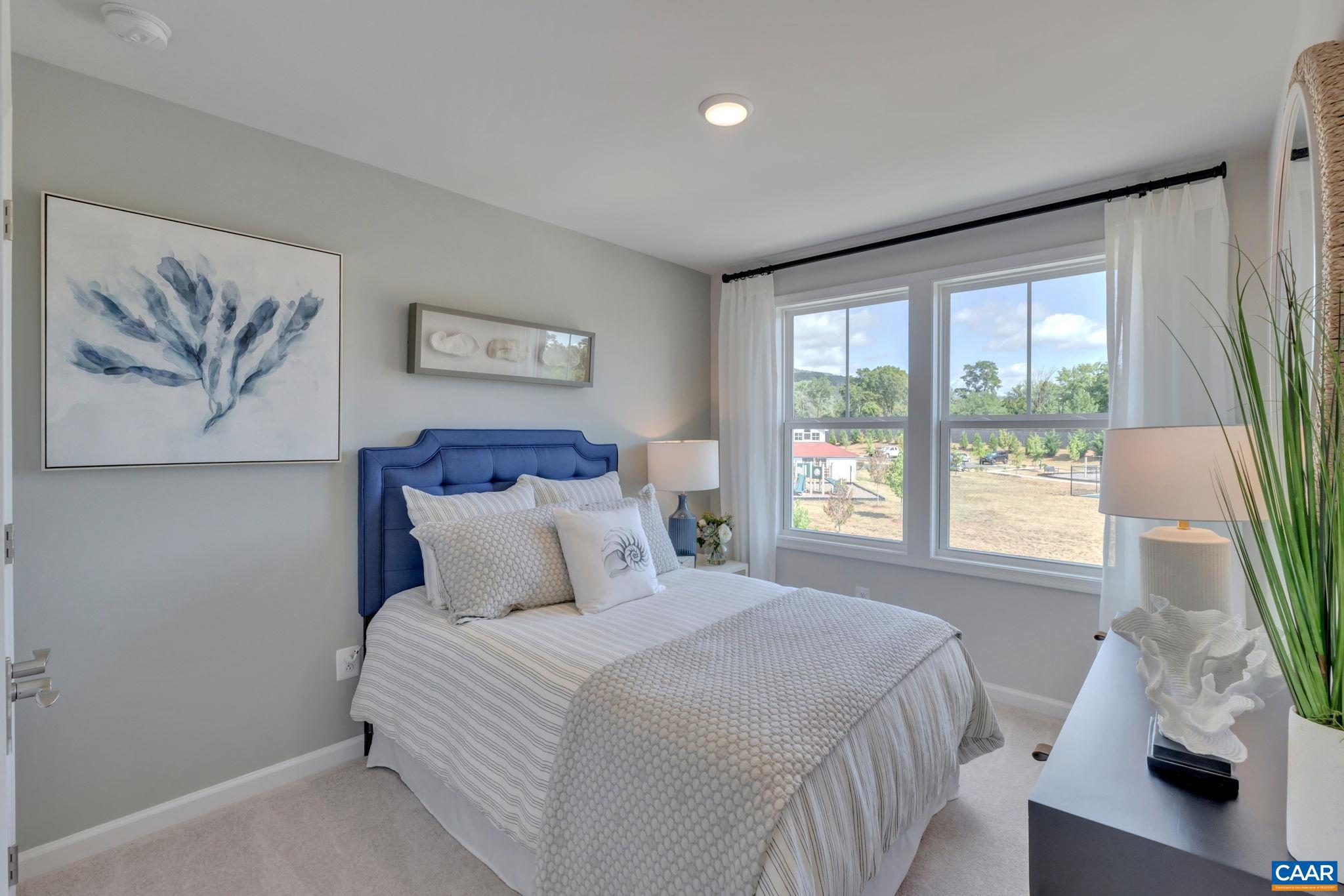 2990 Rambling Brk Lane Crozet, VA 22932 - Photo 20 of 44 a bedroom with a large bed and a window