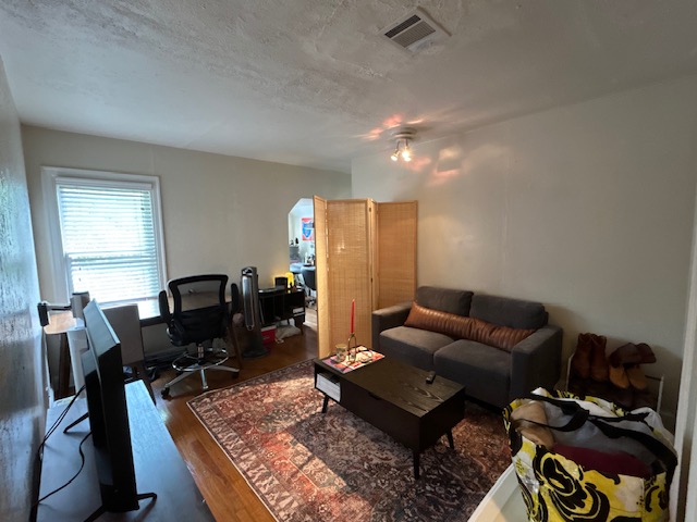 906 West 22nd Street, Unit 4 Austin, TX 78705 - Photo 1 of 7 a living room with furniture rug and a window