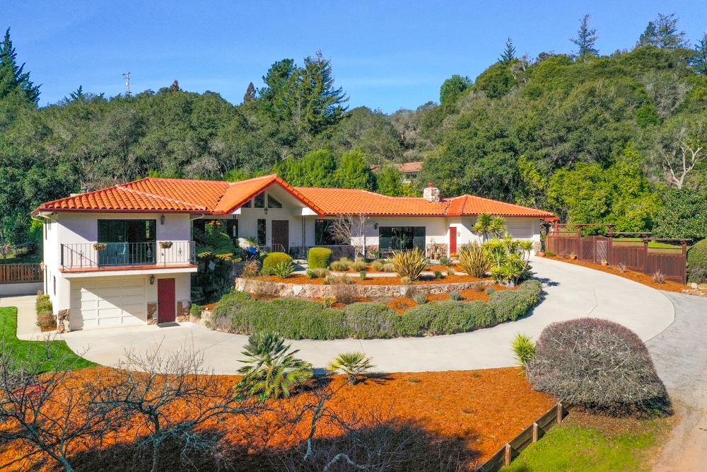 115 Santa Fe Ridge Aptos, CA 95003 - Photo 1 of 50 a view of a house with swimming pool and a yard