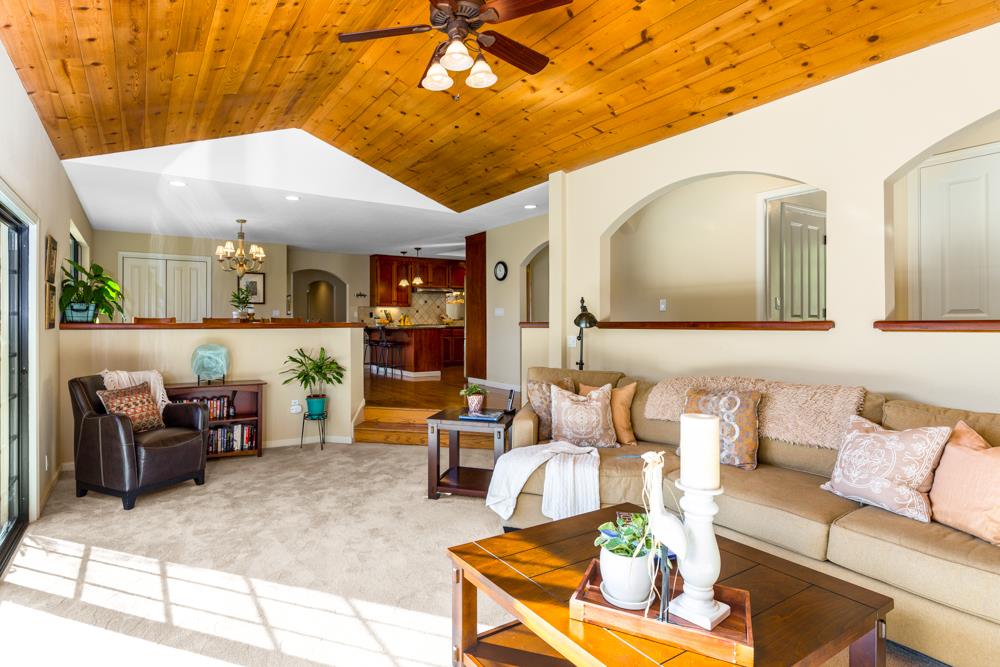 115 Santa Fe Ridge Aptos, CA 95003 - Photo 11 of 50 a living room with furniture and a chandelier