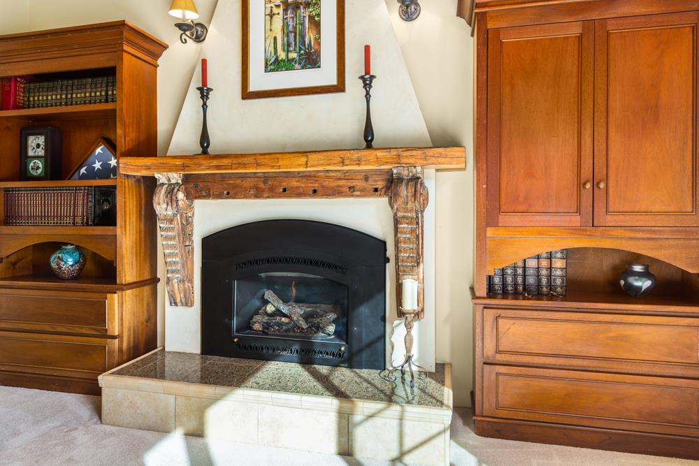 115 Santa Fe Ridge Aptos, CA 95003 - Photo 12 of 50 a living room with a fireplace furniture and a fireplace