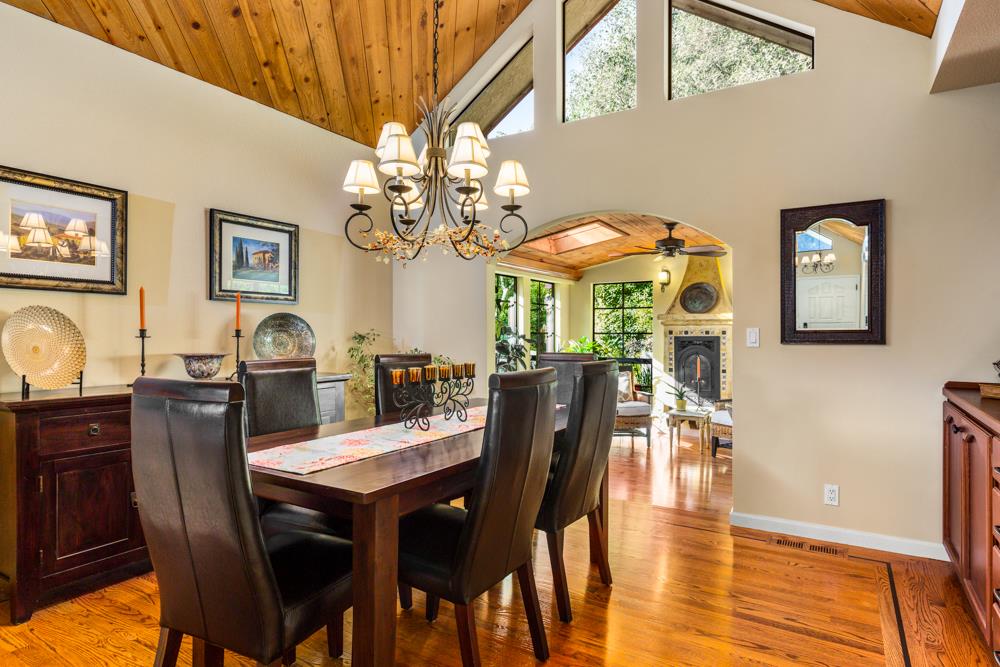 115 Santa Fe Ridge Aptos, CA 95003 - Photo 20 of 50 a view of a dining room with furniture and chandelier