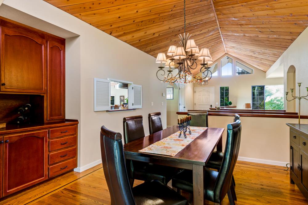 115 Santa Fe Ridge Aptos, CA 95003 - Photo 22 of 50 a view of a dining room with furniture and window
