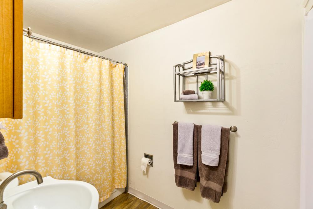 115 Santa Fe Ridge Aptos, CA 95003 - Photo 34 of 50 a bathroom with a sink mirror and toilet