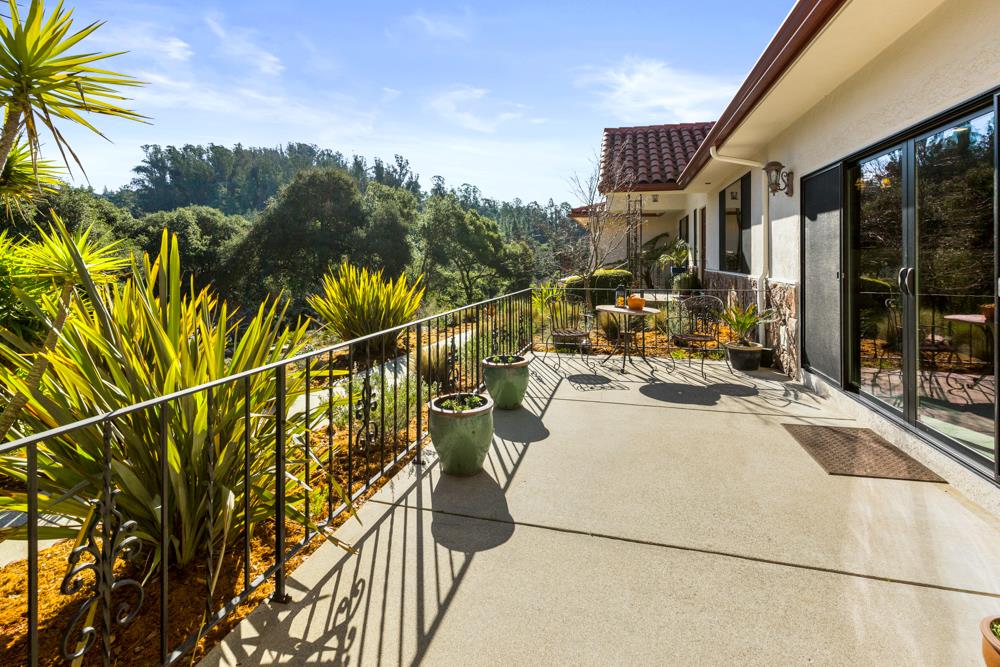 115 Santa Fe Ridge Aptos, CA 95003 - Photo 45 of 50 a view of a swimming pool with potted plants and palm trees