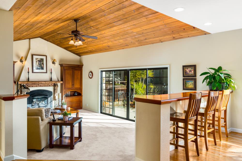 115 Santa Fe Ridge Aptos, CA 95003 - Photo 9 of 50 a view of a patio with a table and chairs