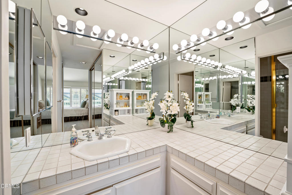 3310 Sunset Lane Oxnard, CA 93035 - Photo 20 of 29 a bathroom with a sink vanity and a mirror