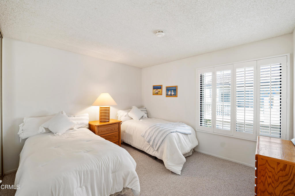 3310 Sunset Lane Oxnard, CA 93035 - Photo 22 of 29 a bedroom with two beds and a large window