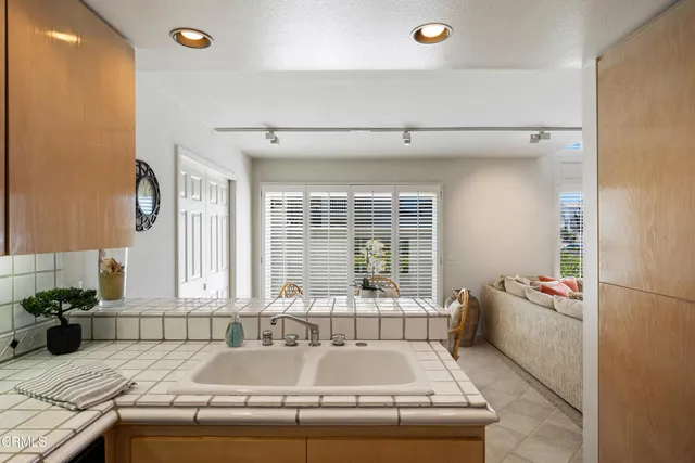 a bath tub sitting in a bathroom next to a window