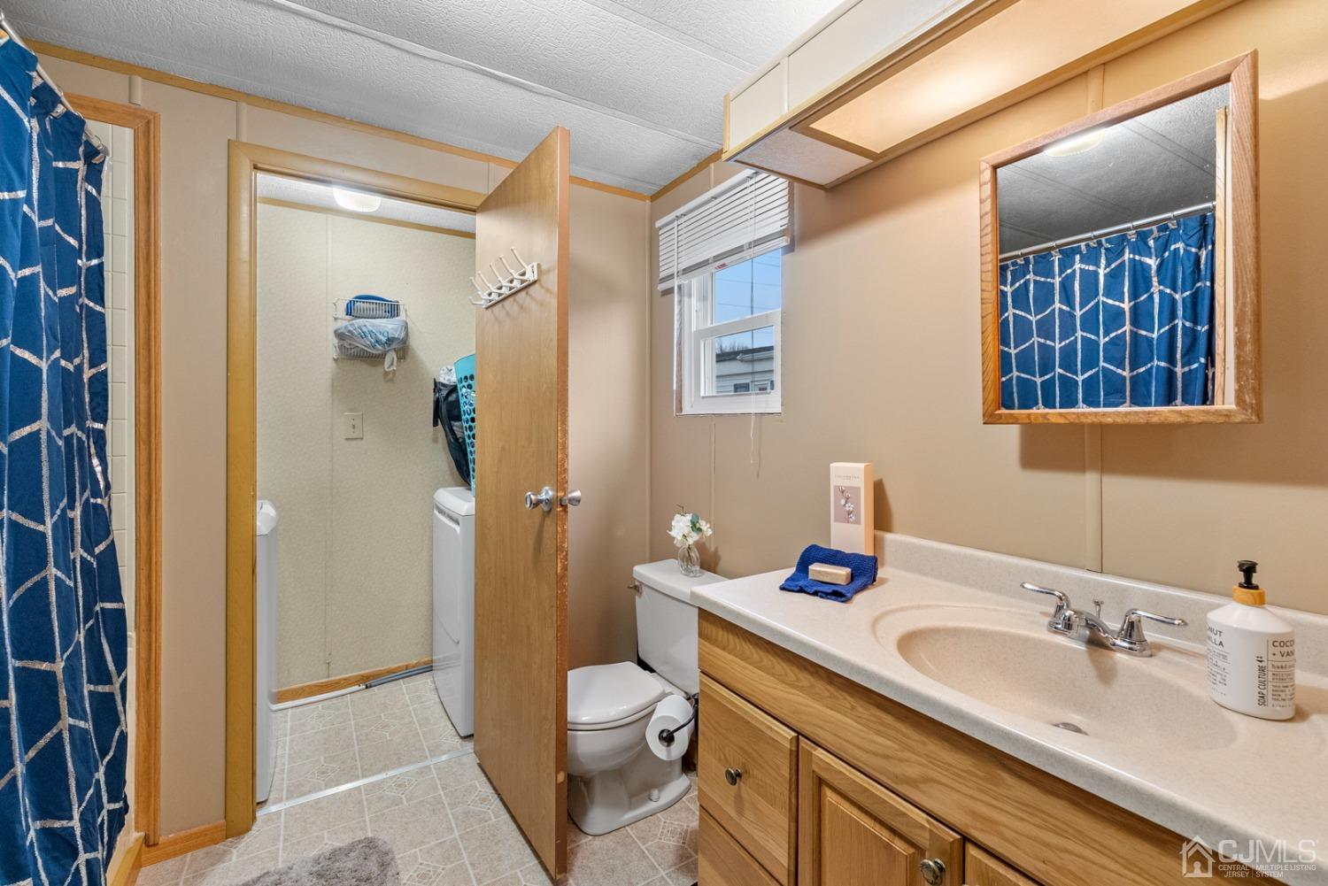36 Whitman Road North Brunswick, NJ 08902 - Photo 17 of 31 a bathroom with a granite countertop sink toilet and shower