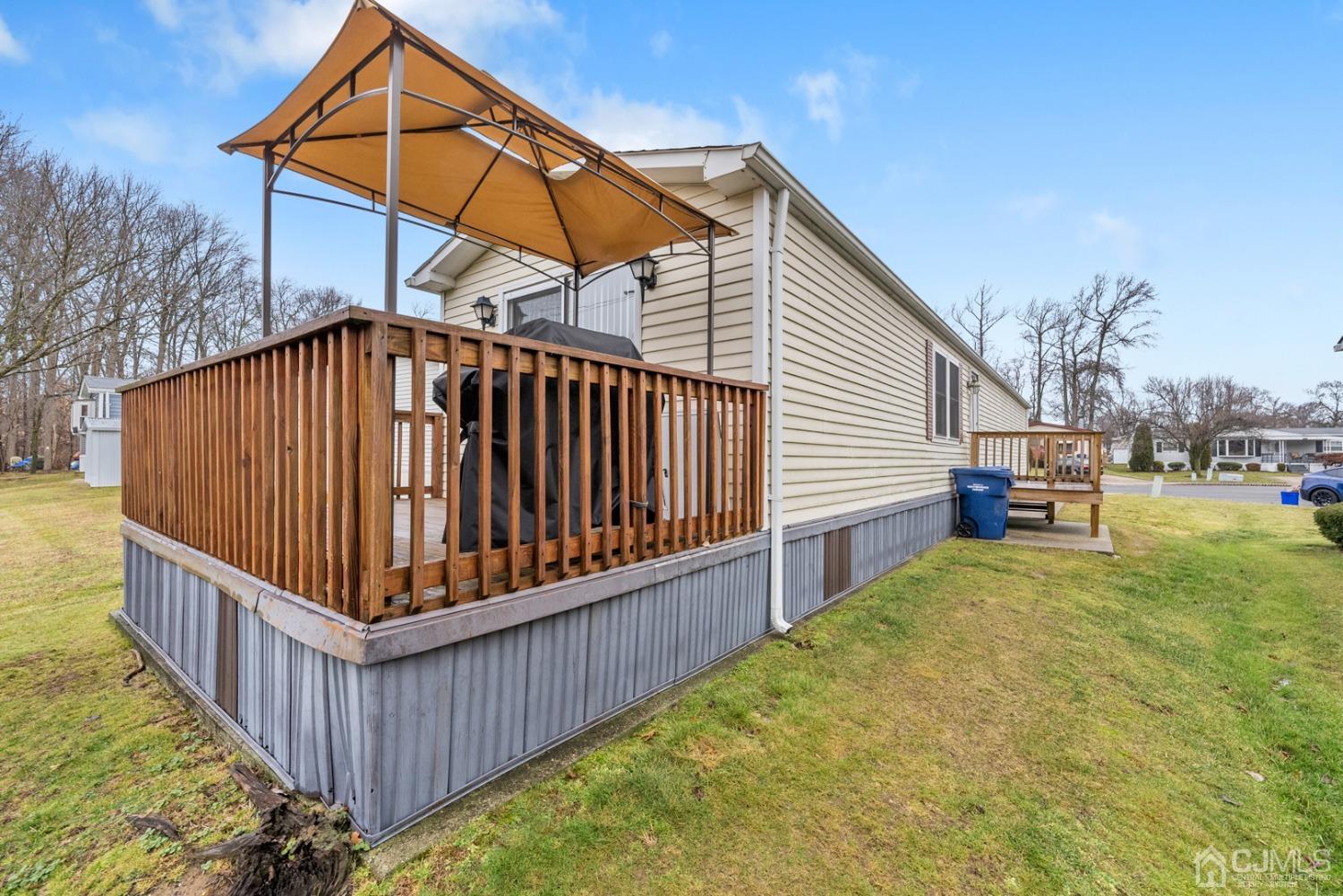 36 Whitman Road North Brunswick, NJ 08902 - Photo 23 of 31 a view of backyard with deck and wooden fence