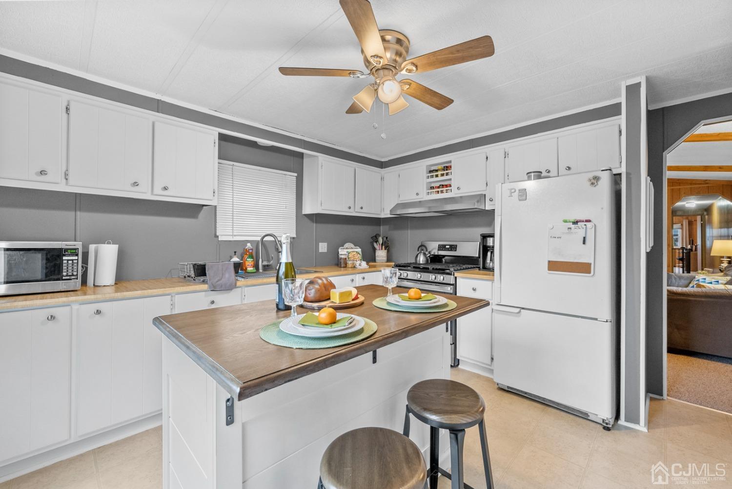 36 Whitman Road North Brunswick, NJ 08902 - Photo 5 of 31 a kitchen with stainless steel appliances granite countertop a sink a refrigerator and a stove