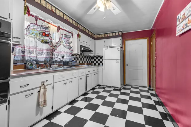 a bedroom with a bed and glass windows