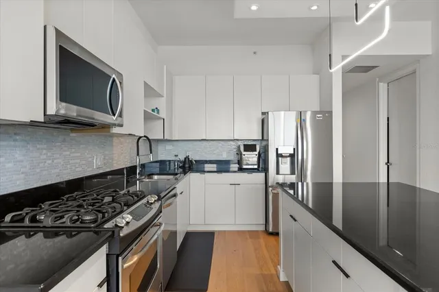 a kitchen with a stove and a microwave