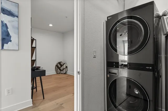 a close view of a utility room with dryer and washer
