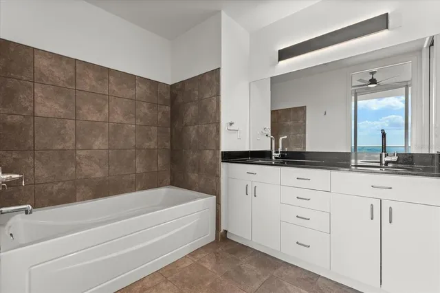 a bathroom with a bathtub and a sink