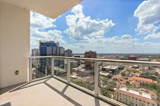 a view of a balcony with city view