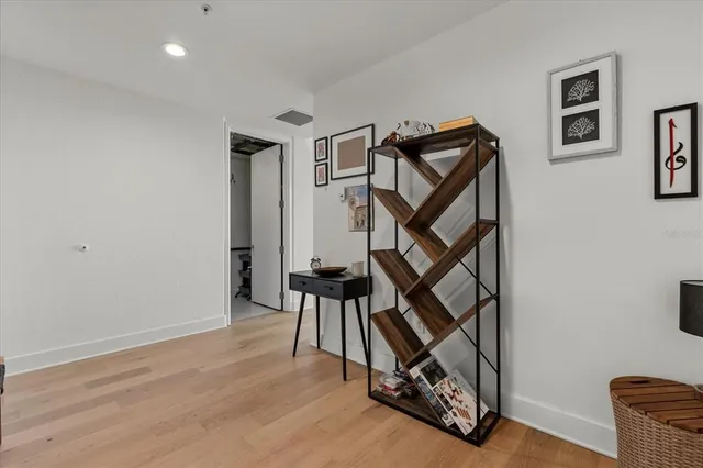 a view of an empty room and wooden floor