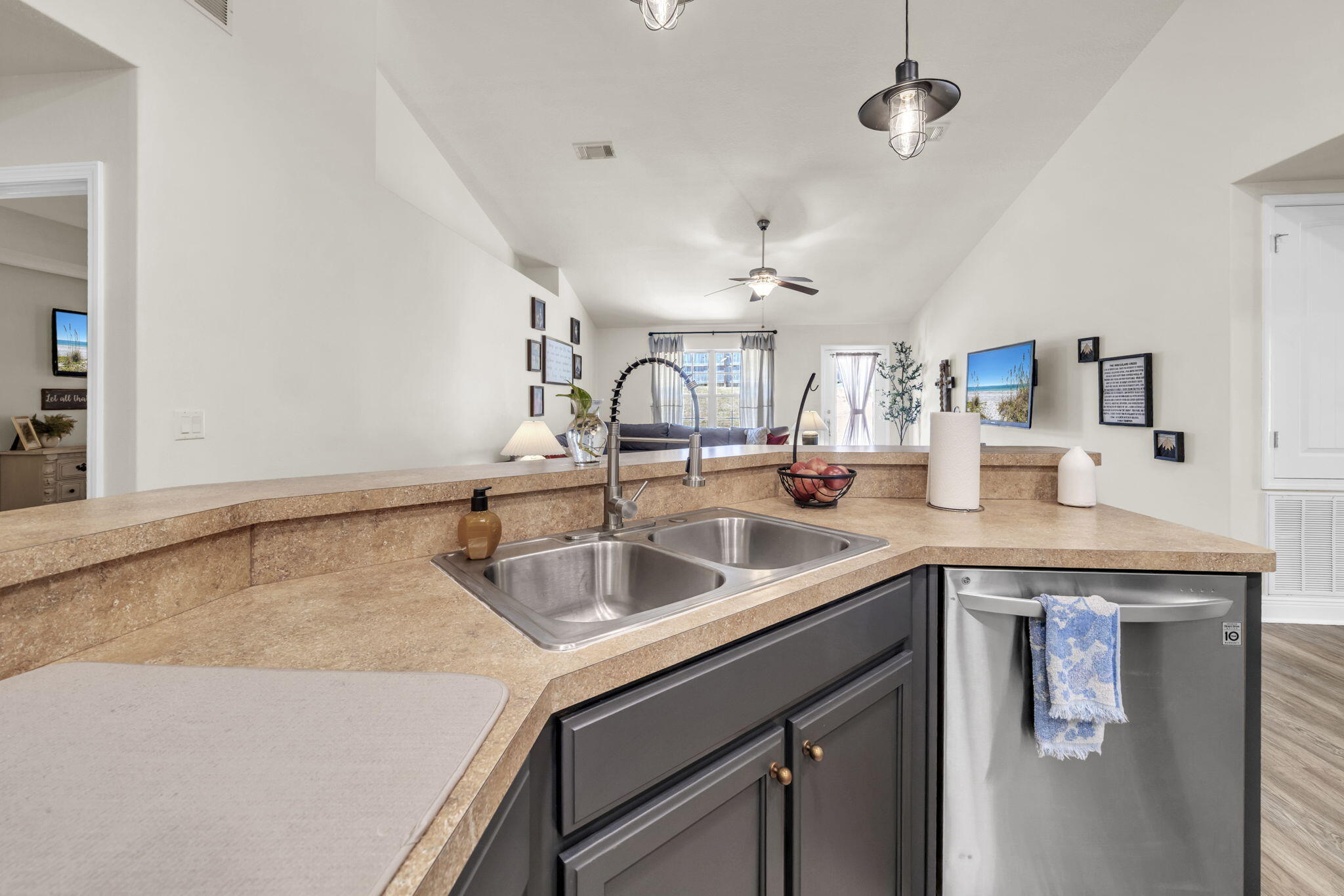 217 Raptor Drive Crestview, FL 32536 - Photo 21 of 48 a kitchen with a sink and a refrigerator