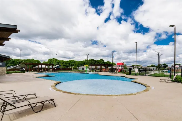 a view of a swimming pool and a terrace