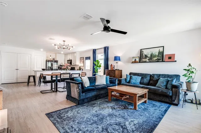 a living room with furniture and a rug