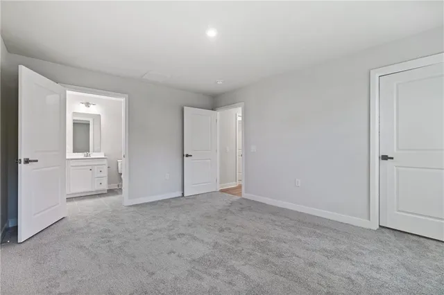 a view of an empty room and closet area