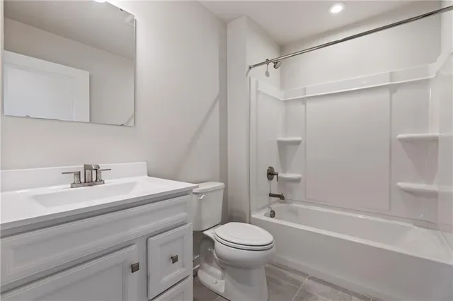 a bathroom with a sink a toilet and a bathtub