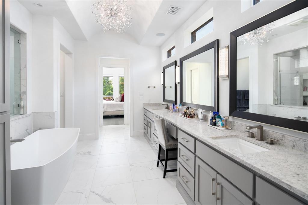 818 Brett Drive Allen, TX 75013 - Photo 15 of 38 a spacious en suite bathroom with a double vanity sink and a mirror