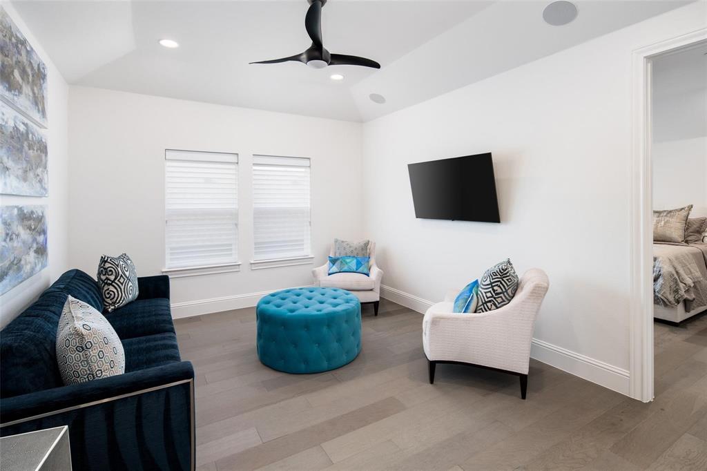 818 Brett Drive Allen, TX 75013 - Photo 21 of 38 a living room with furniture and a flat screen tv