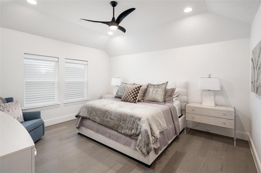 818 Brett Drive Allen, TX 75013 - Photo 26 of 38 a spacious bedroom with a bed and a couch