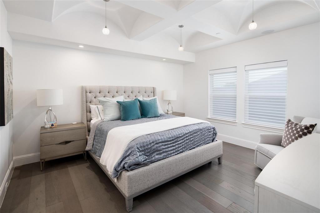 818 Brett Drive Allen, TX 75013 - Photo 27 of 38 a spacious bedroom with a bed and window