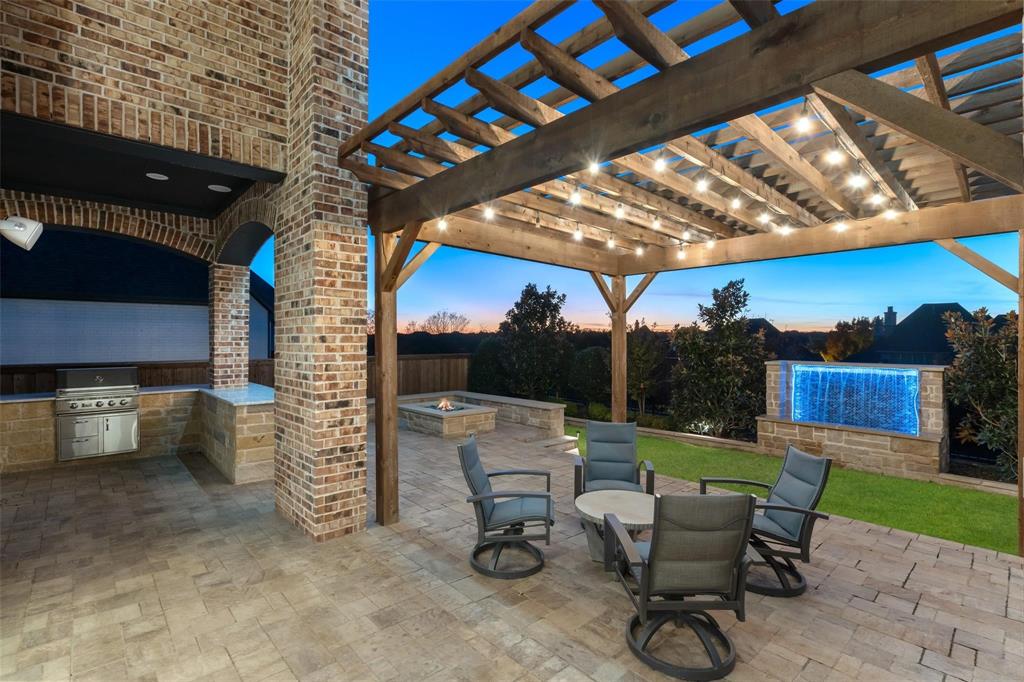 818 Brett Drive Allen, TX 75013 - Photo 31 of 38 a view of a chairs and table in backyard of the house