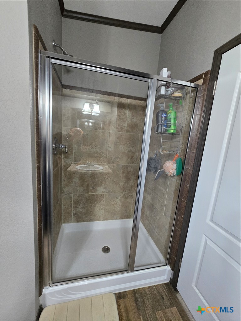 390-400 North Fawn Ridge Drive Leander, TX 78641 - Photo 19 of 48 a bathroom with a glass door shower and vanity
