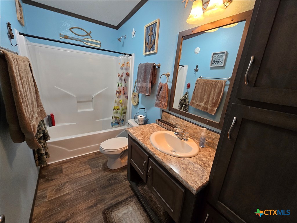 390-400 North Fawn Ridge Drive Leander, TX 78641 - Photo 24 of 48 a bathroom with a granite countertop sink toilet and shower