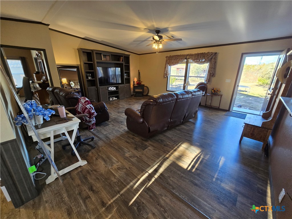 390-400 North Fawn Ridge Drive Leander, TX 78641 - Photo 9 of 48 a living room with furniture fireplace and a flat screen tv