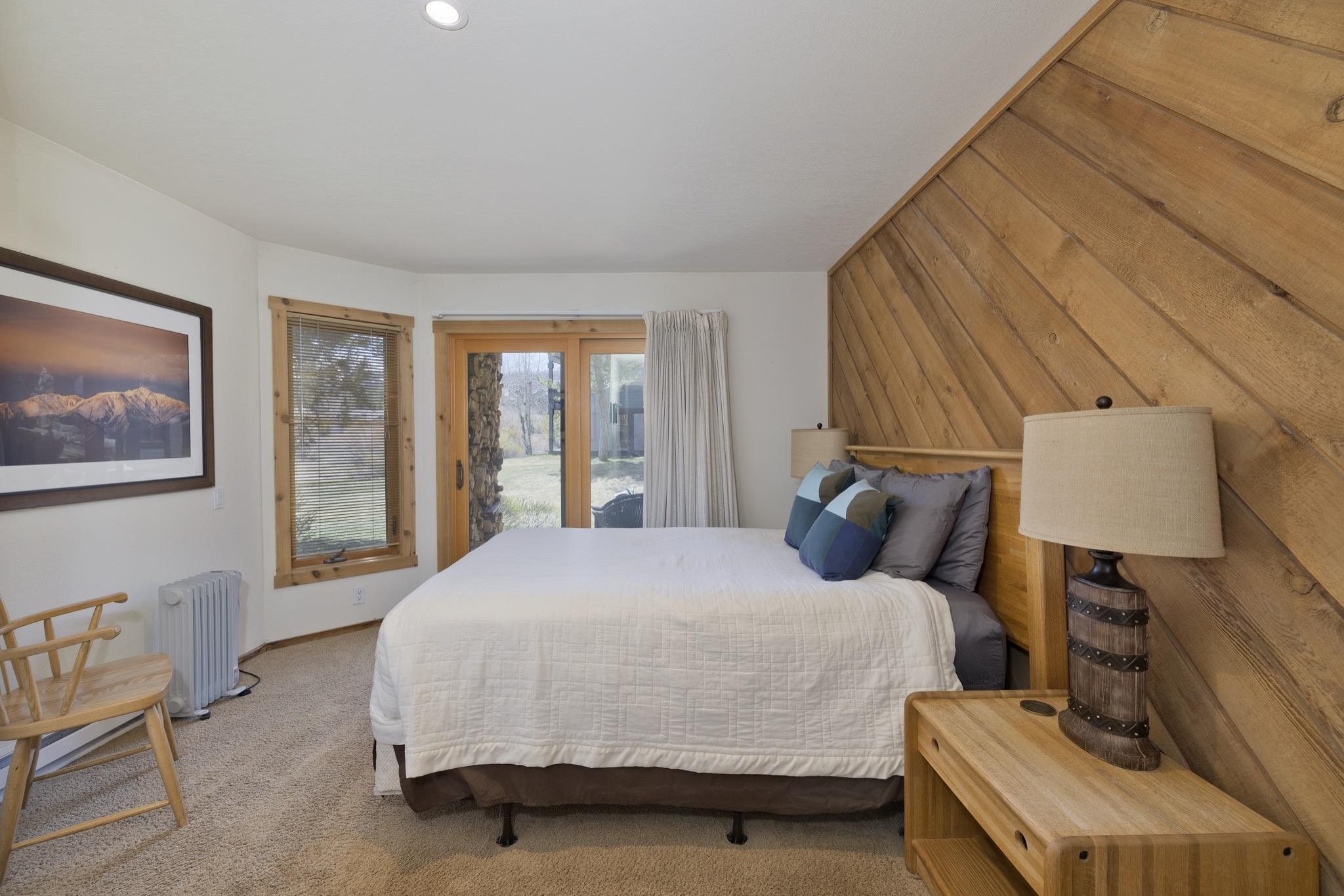 417 Snowcreek Road, Unit 417 Mammoth Lakes, CA 93546 - Photo 26 of 31 Angled wood paneling accent wall, recessed ceiling lighting, and large window with wood trim