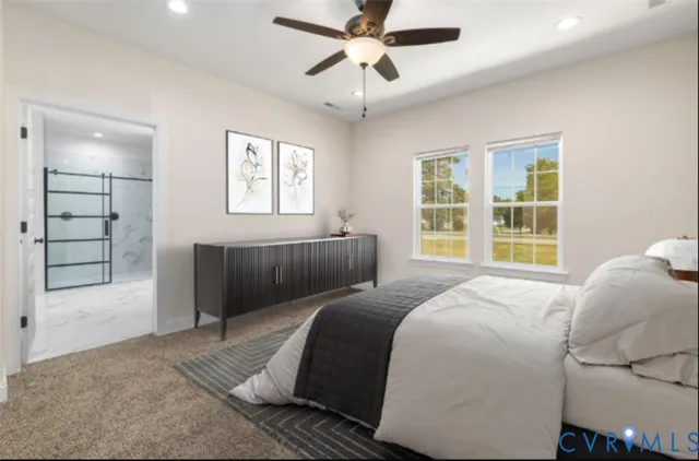 a bedroom with a large bed and a window