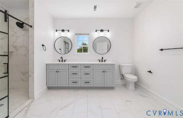 a bathroom with a toilet a sink and a mirror