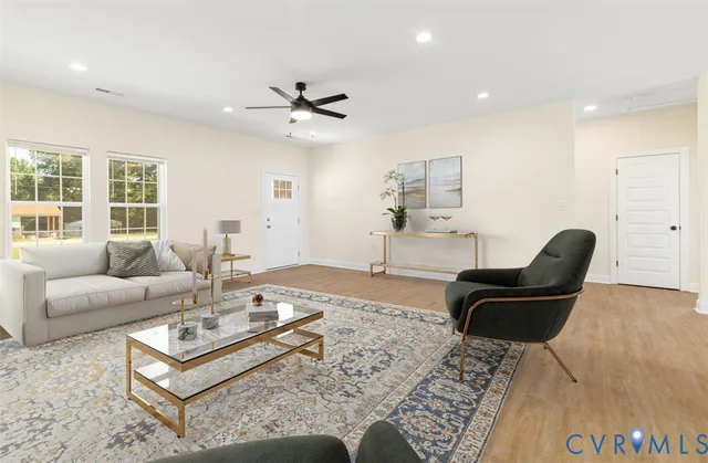 a living room with furniture and a large window